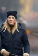 LINDA DE MOL and partner take a walk with their dogs