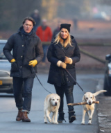 LINDA DE MOL and partner take a walk with their dogs