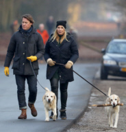 LINDA DE MOL and partner take a walk with their dogs