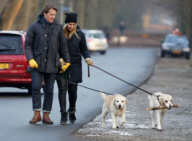 LINDA DE MOL and partner take a walk with their dogs