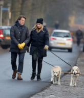 LINDA DE MOL and partner take a walk with their dogs