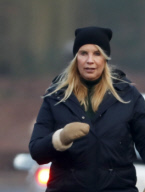 LINDA DE MOL and partner take a walk with their dogs