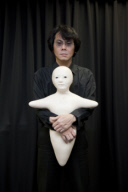 Hiroshi Ishiguro with his Telenoid robot
