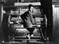Israeli actress Daliah Lavi sitting at an organ, 1961.