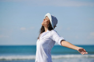 happy young woman relax onbeautiful  beach at morning