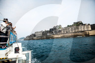 FEATURE - Die verfallene "Kriesgsschiff-Insel" Hashima bei Nagasaki ist eine Touristenattraktionl