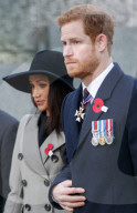 Britain's Prince Harry and his US fiancee Meghan Markle attend an Anzac Day dawn service at Hyde Park Corner in London on April 25, 2018. 
Anzac Day commemorates Australian and New Zealand casualties and veterans of conflicts and marks the anniversary of
