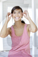 Dark haired woman in pink tank top