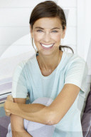Sporty woman relaxing on the terrace