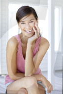 Dark haired woman in pink tank top