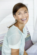 Sporty woman relaxing on the terrace
