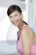 Dark haired woman in pink tank top