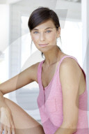Dark haired woman in pink tank top