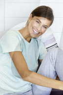 Sporty woman relaxing on the terrace