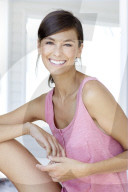 Dark haired woman in pink tank top