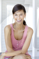 Dark haired woman in pink tank top