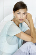 Sporty woman relaxing on the terrace