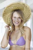 Happy blond woman in lilac bikini