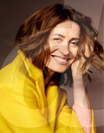 Smiling Woman wearing a yellow Coat