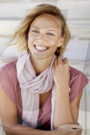 Portrait of a young Woman wearing T-Shirt and a Scarf