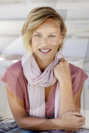 Portrait of a young Woman wearing T-Shirt and a Scarf