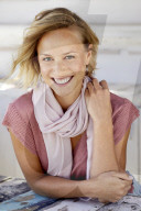 Portrait of a young Woman wearing T-Shirt and a Scarf