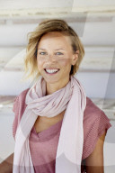 Portrait of a young Woman wearing T-Shirt and a Scarf