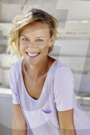 Portrait of a young sporty Woman wearing a T-Shirt
