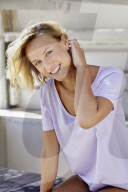 Portrait of a young sporty Woman wearing a T-Shirt