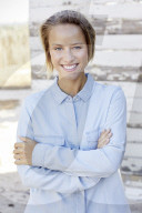 Portrait of a young Woman wearing a blue Shirt