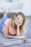 Blond woman relaxing on the deck