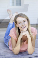 Blond woman relaxing on the deck