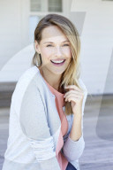 Young woman in babyblue cardigan