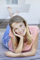 Blond woman relaxing on the deck