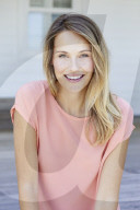 Young woman in salmon silk top