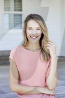 Young woman in salmon silk top