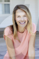 Young woman in salmon silk top
