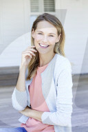 Young woman in babyblue cardigan
