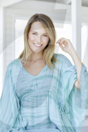 Young woman in turqouise hippie-dress