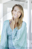 Young woman in turqouise hippie-dress