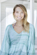 Young woman in turqouise hippie-dress