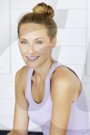 Sporty woman relaxing on the terrace