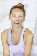 Sporty woman relaxing on the terrace