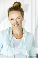 Sporty woman in mint coloured hoodie
