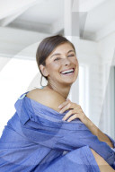 Happy woman in bikini and denim shirt 