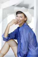 Happy woman with white straw hat 