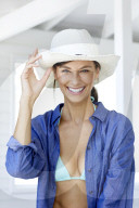 Happy woman with white straw hat 