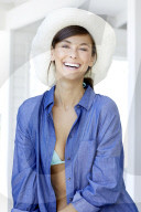 Happy woman with white straw hat 
