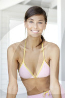 Happy woman in pink terry cloth bikini 
