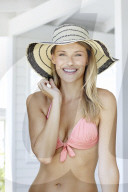 Young blond woman in pink bikini